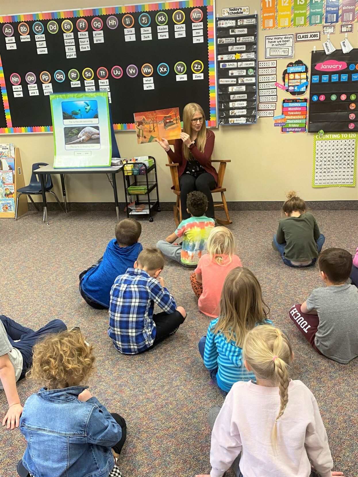 Amanda Geelan shares a book with her students at Forest City Elementary School 2.jpg